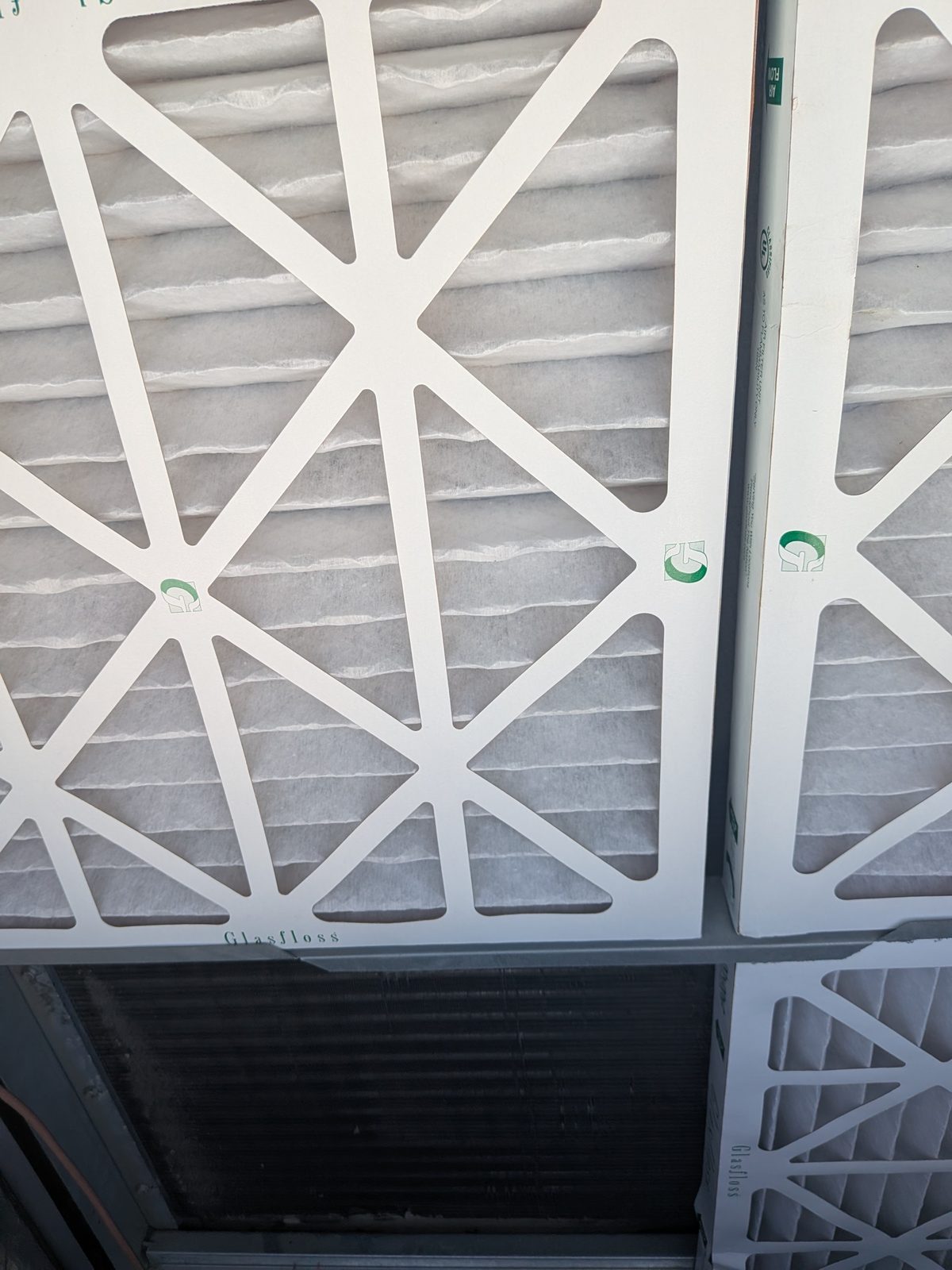 A clean, properly sized pleated air filter installed in a return plenum