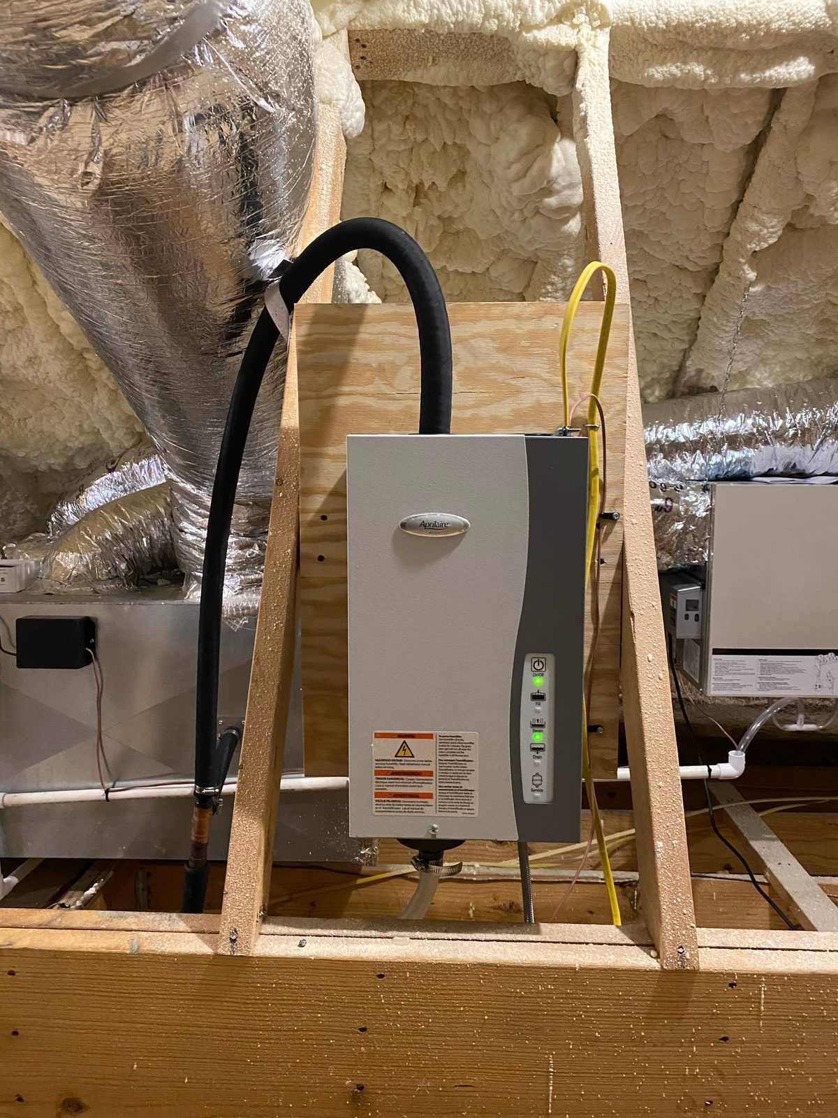 Aprilaire steam humidifier mounted and connected to ductwork