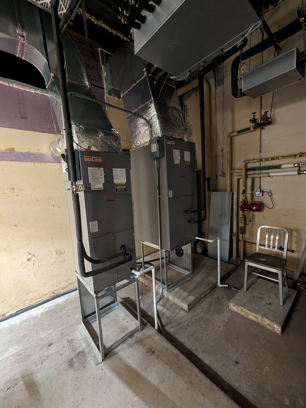 Two Toshiba-Carrier VRF indoor air handlers installed in a commercial mechanical room
