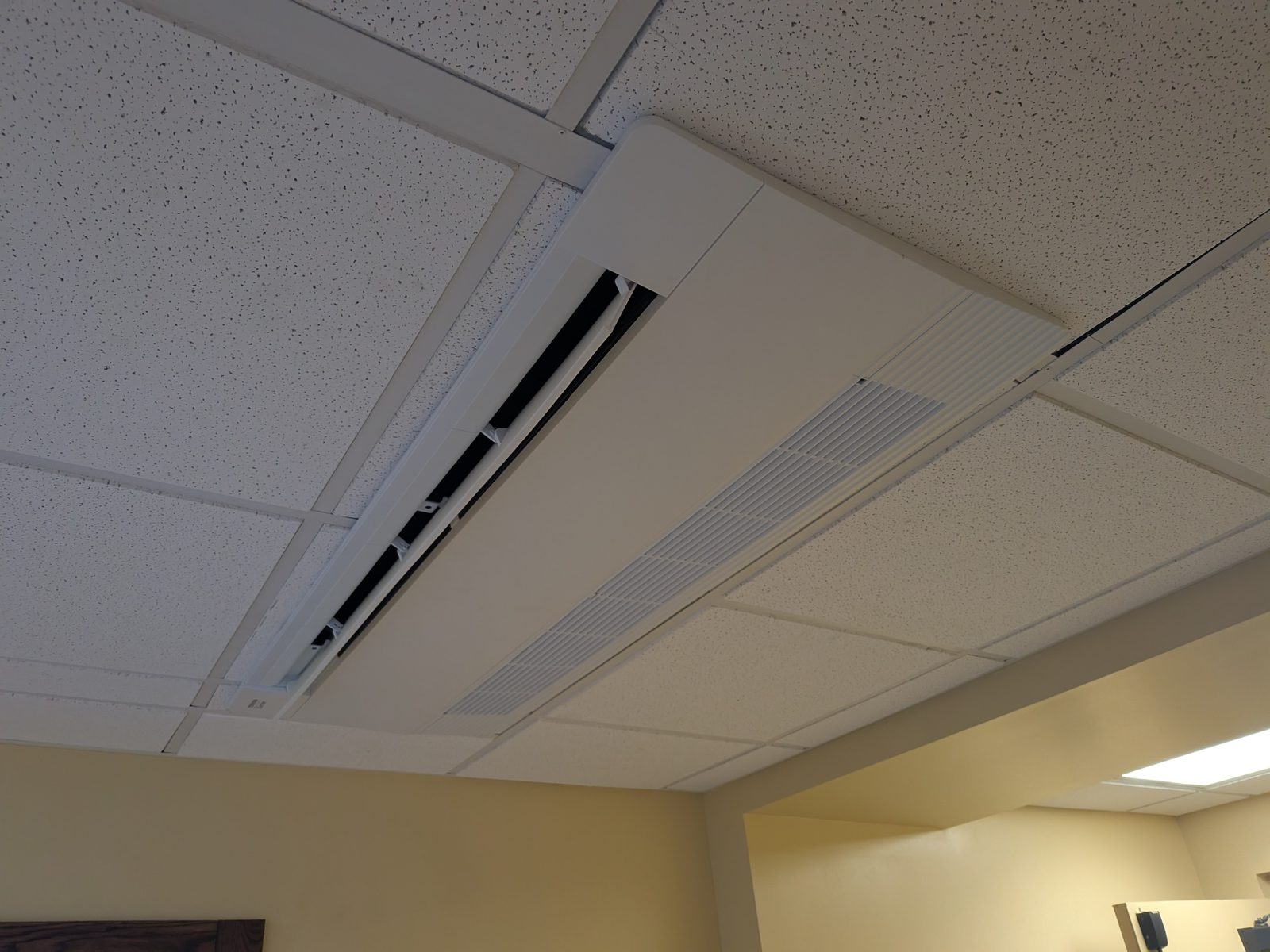 Toshiba-Carrier VRF one-way ceiling cassette installed in a commercial office ceiling grid